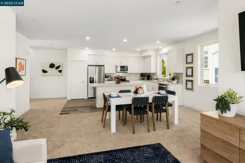 a large kitchen with a table and chairs