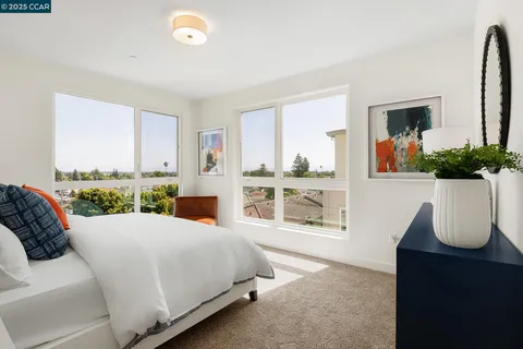 a bed room with a bed and a chair