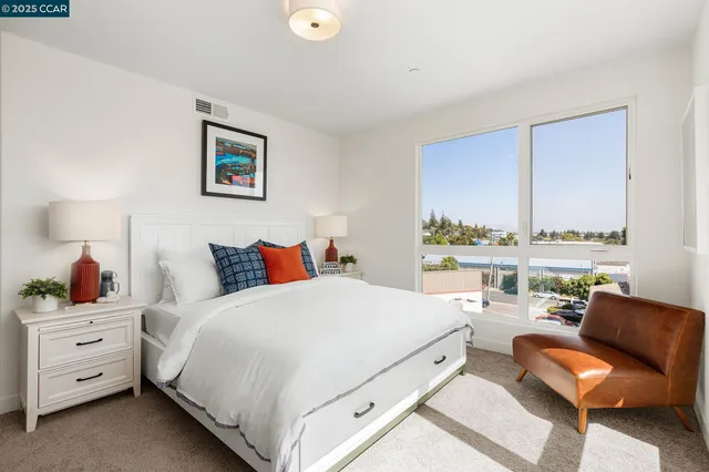 a bedroom with a bed and a couch