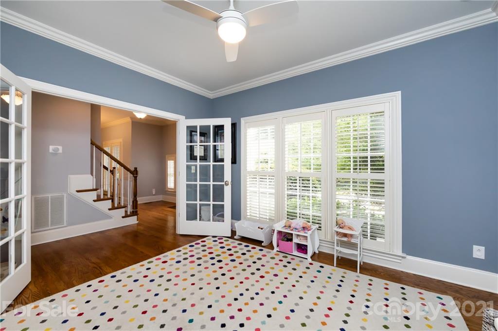 817 Millbrook Road Charlotte, NC 28211 - Photo 11 of 26 a bedroom with furniture and a window