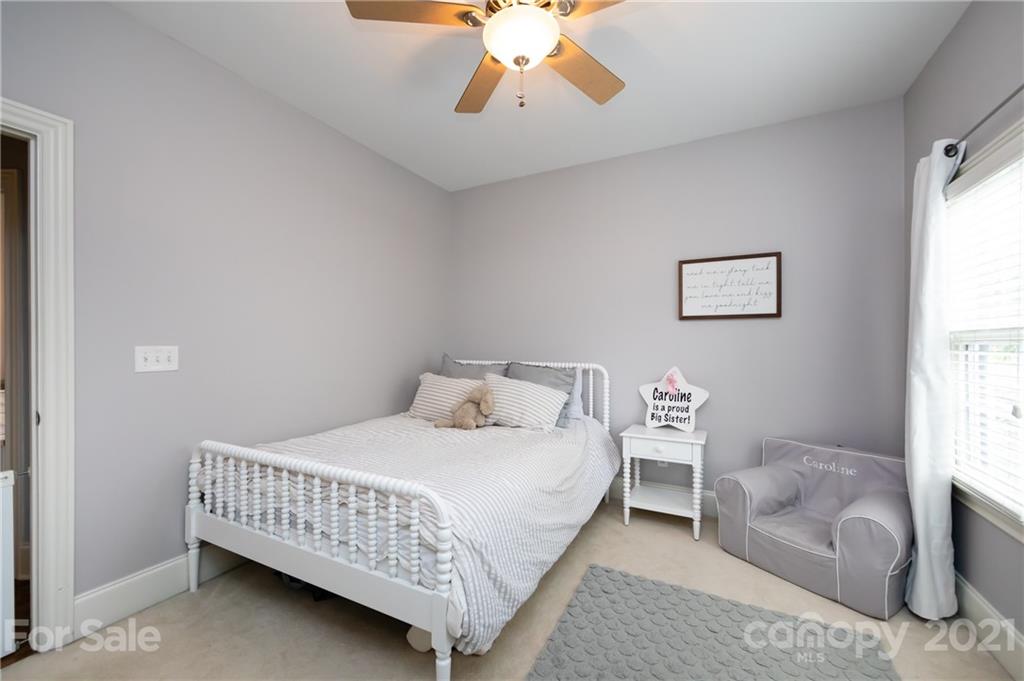 817 Millbrook Road Charlotte, NC 28211 - Photo 16 of 26 a bedroom with a bed couch and window