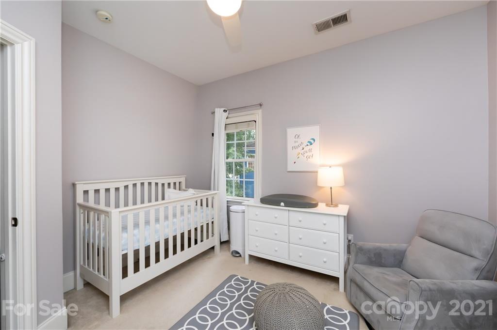 817 Millbrook Road Charlotte, NC 28211 - Photo 19 of 26 a bedroom with furniture and windows