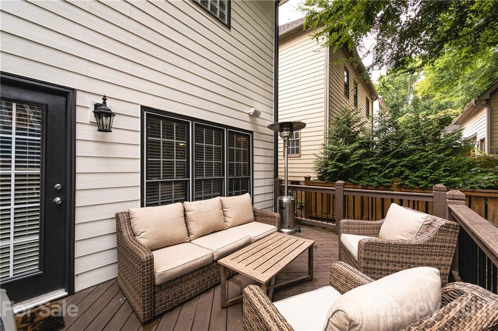 817 Millbrook Road Charlotte, NC 28211 - Photo 26 of 26 a balcony with furniture and a potted plant