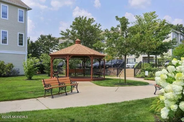 a view of a table and chairs under an umbrella