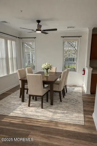 a dining room with furniture and window