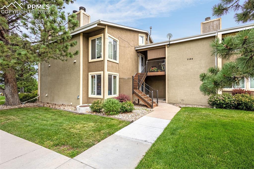 a front view of a house with a yard