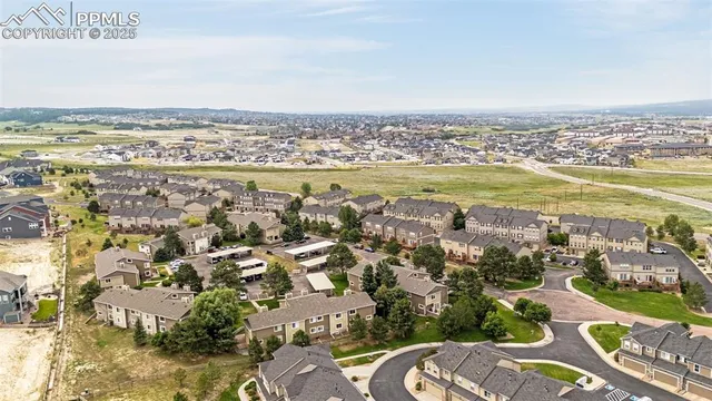 an aerial view of residential building and lake
