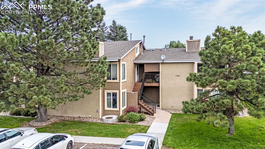 1160 Magic Lamp Way, Unit 4 Monument, CO 80132 - Photo 3 of 23 front view of a house with a yard