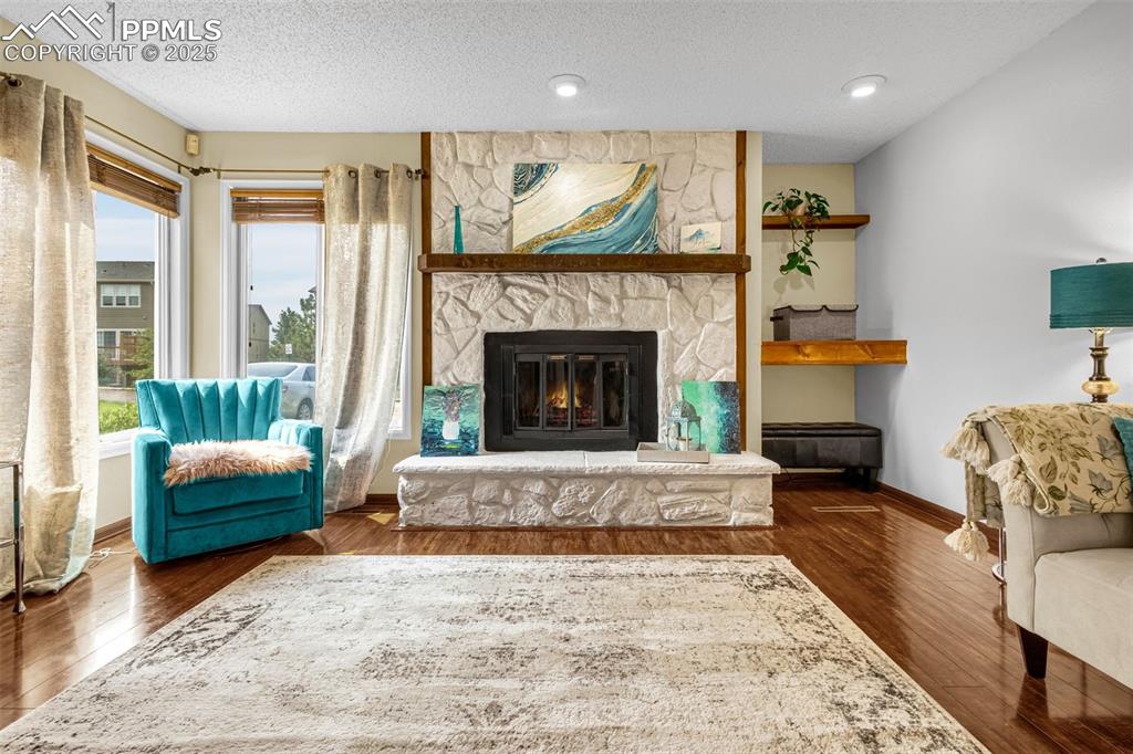 1160 Magic Lamp Way, Unit 4 Monument, CO 80132 - Photo 5 of 23 a living room with furniture and a fireplace