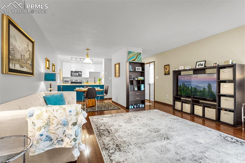 1160 Magic Lamp Way, Unit 4 Monument, CO 80132 - Photo 6 of 23 a living room with furniture and a flat screen tv