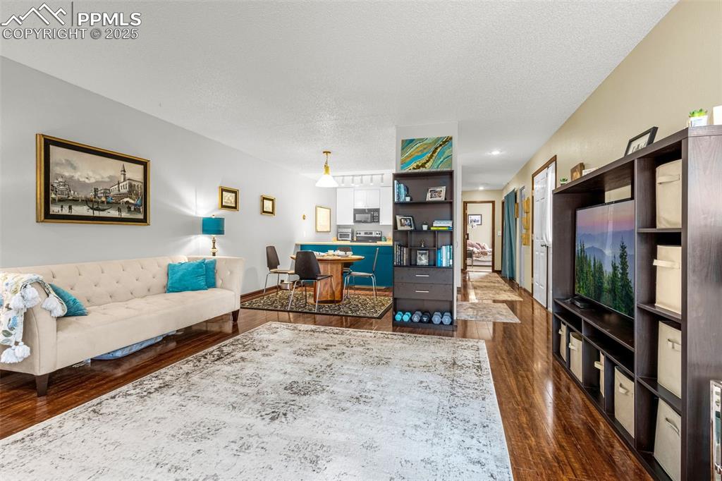1160 Magic Lamp Way, Unit 4 Monument, CO 80132 - Photo 7 of 23 a living room with furniture and a flat screen tv