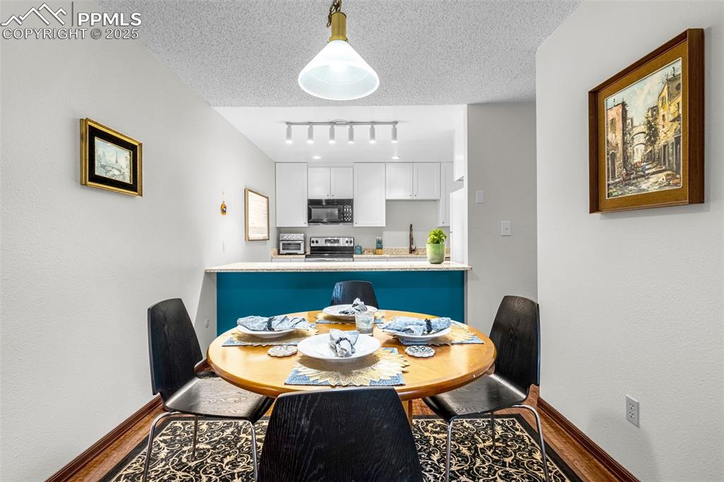 1160 Magic Lamp Way, Unit 4 Monument, CO 80132 - Photo 8 of 23 a view of a dining room with furniture