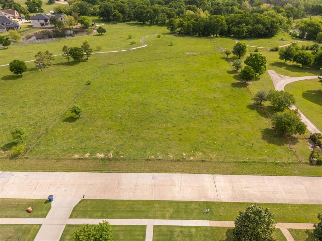 Tbd Sleepy Hollow Road Ennis, TX 75119 - Photo 4 of 11 Expansive green space with mature trees and a paved road frontage
