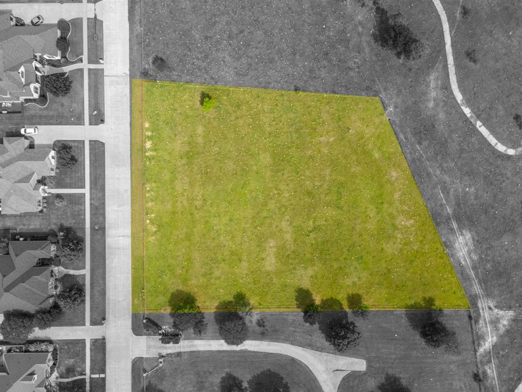 Tbd Sleepy Hollow Road Ennis, TX 75119 - Photo 8 of 11 Aerial view of the property, featuring a large grassy lot with a single tree and bordering a paved road