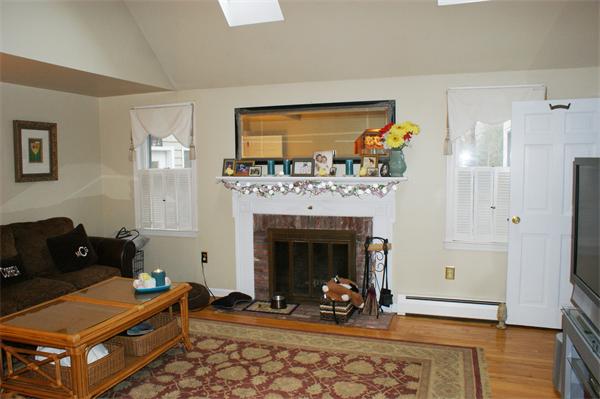 97 Olde Knoll Road Marion, MA 02738 - Photo 15 of 28 a living room with furniture and a fireplace