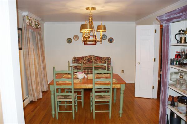 97 Olde Knoll Road Marion, MA 02738 - Photo 7 of 28 a dining room with furniture a chandelier and window