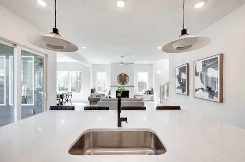 a view of a dining room with furniture wooden floor and a chandelier