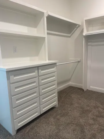a view of an empty walk in closet