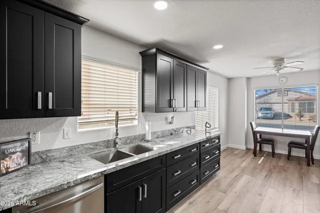 a kitchen with a sink and cabinets