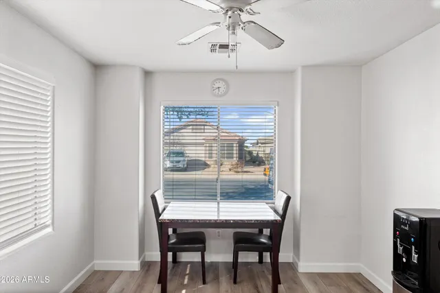a view of a dining room with furniture window and wooden floor