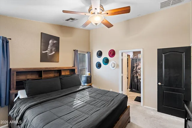 a bedroom with a bed and a dresser