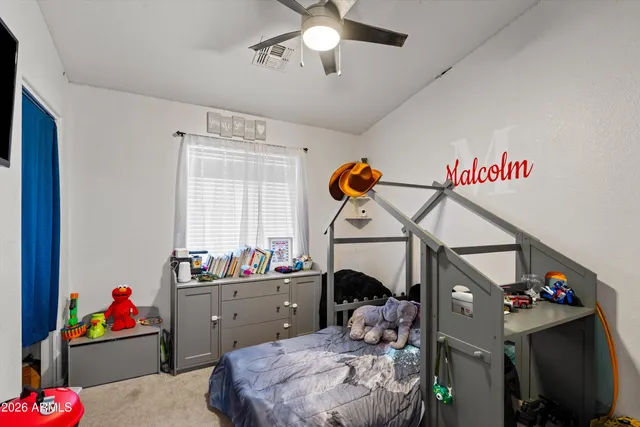 a bed room with a bed and a window