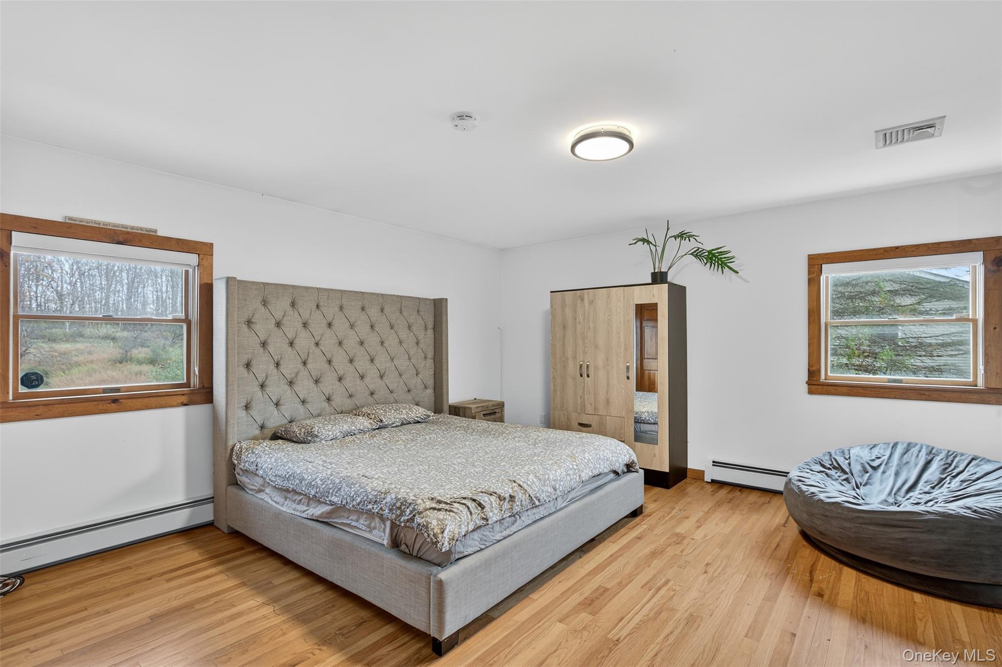 158 Wade Road Liberty, NY 12754 - Photo 12 of 34 a bedroom with a bed and wooden floor