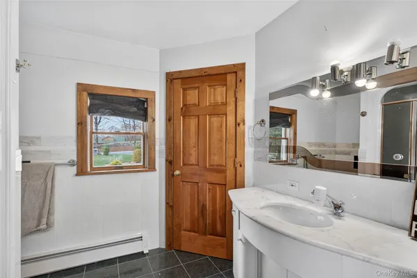 a bathroom with a sink and a mirror