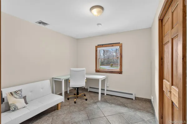 a living room with furniture and a window