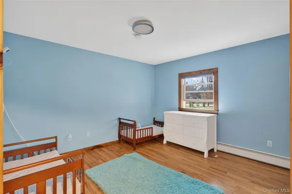 a view of an empty room and wooden floor