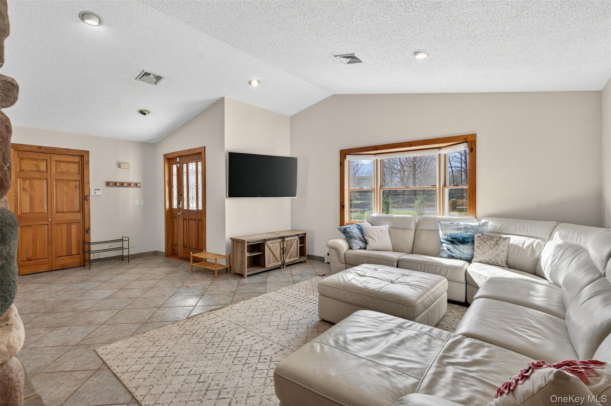 158 Wade Road Liberty, NY 12754 - Photo 4 of 34 a living room with furniture and a flat screen tv