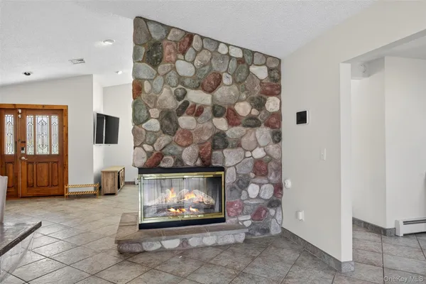 a living room with a fireplace