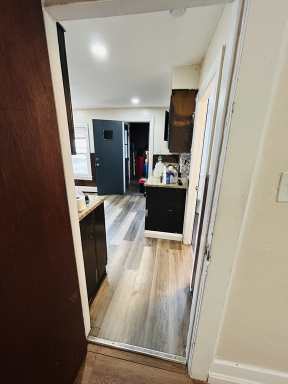5 Palmer Street, Unit 1 Worcester, MA 01605 - Photo 5 of 9 workspace with wooden floor and furniture