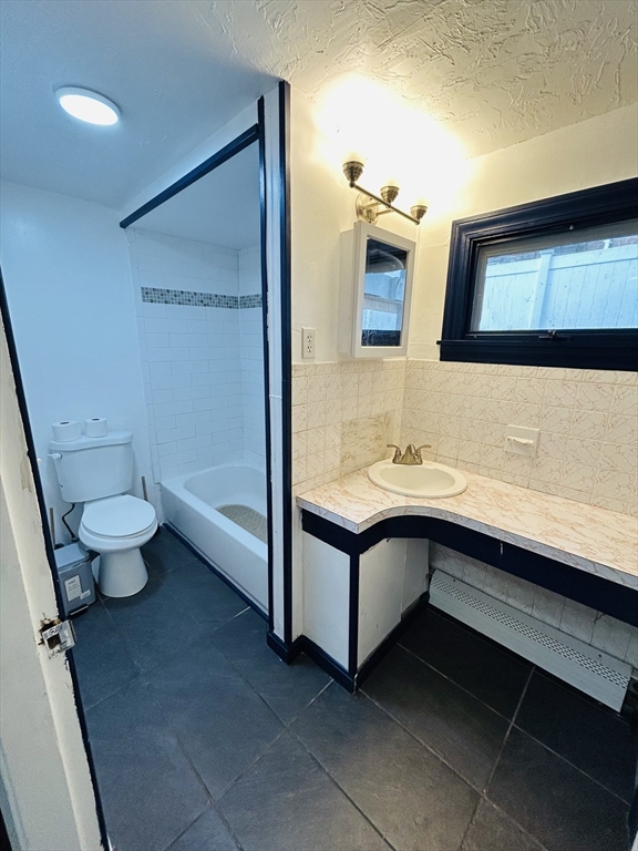 5 Palmer Street, Unit 1 Worcester, MA 01605 - Photo 7 of 9 a bathroom with a sink and a mirror