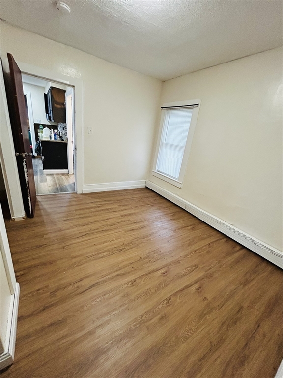 5 Palmer Street, Unit 1 Worcester, MA 01605 - Photo 8 of 9 a view of a livingroom with wooden floor