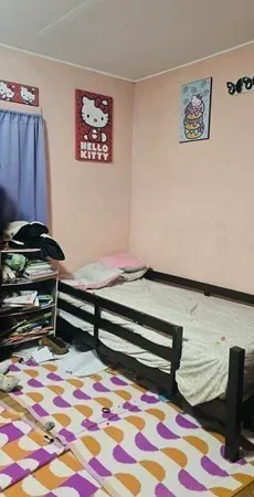 a view of a room with furniture and rug