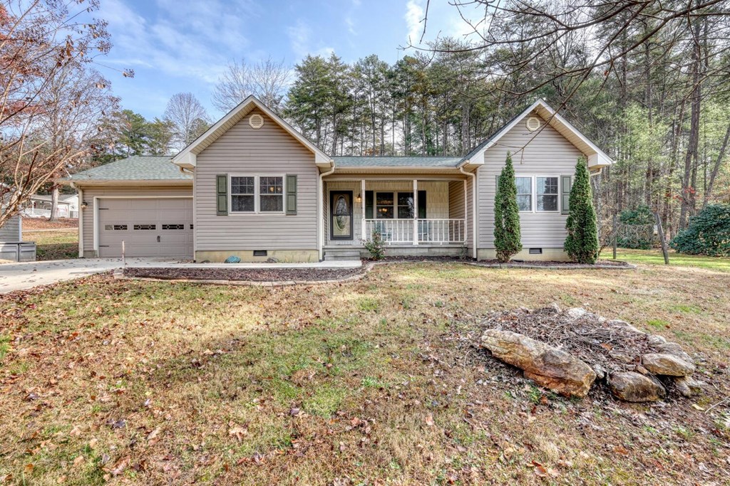 241 12 Point Road Blairsville, GA 30512 - Photo 2 of 34 a front view of a house with a yard and trees
