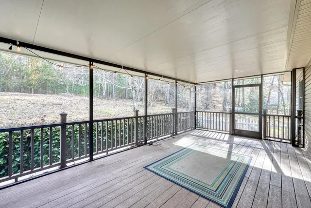 a view of balcony with wooden floor