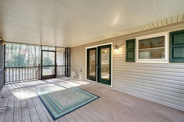 a view of balcony with wooden floor