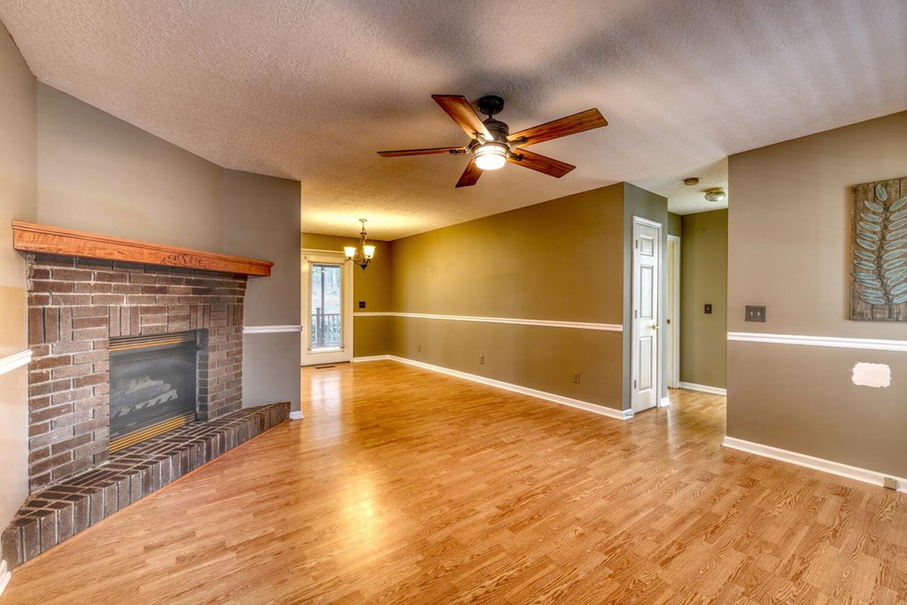 241 12 Point Road Blairsville, GA 30512 - Photo 6 of 34 a view of an empty room with a fireplace and a window