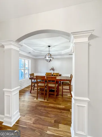 a view of a room with a ceiling fan