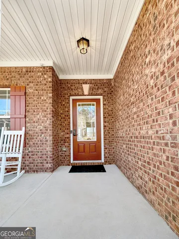 a view of a bedroom with wooden floor and bedroom