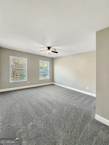 a view of a storage and utility room with washer and dryer