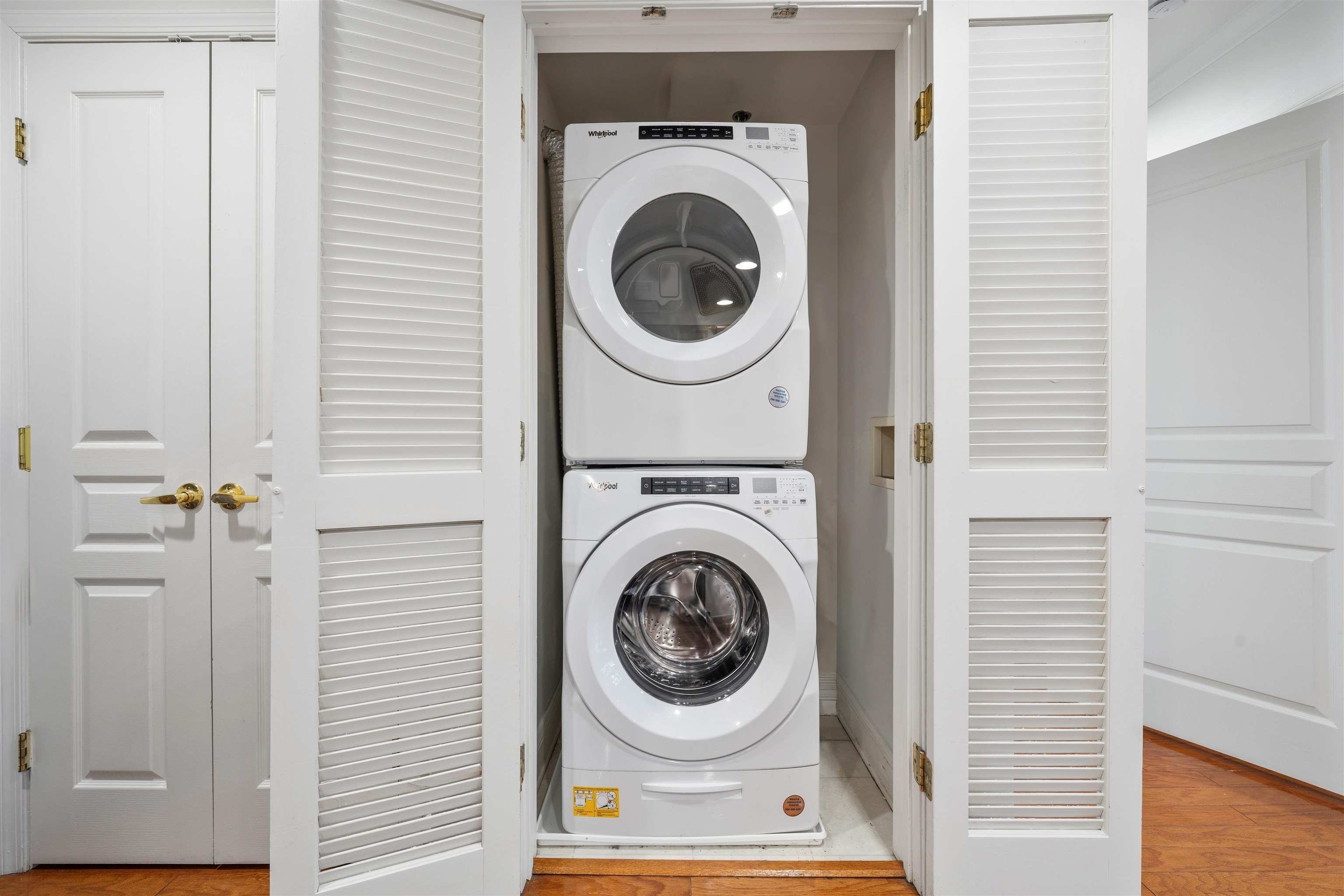 70 Adams Street, Unit 2F Hoboken, NJ 07030 - Photo 13 of 20 a view of a hallway with washer and dryer