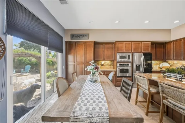 a very nice looking living room with a large window and a table