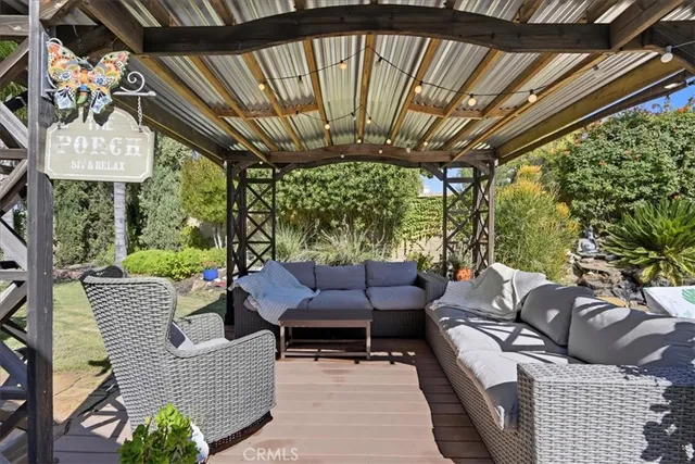 a outdoor living space with furniture and garden view