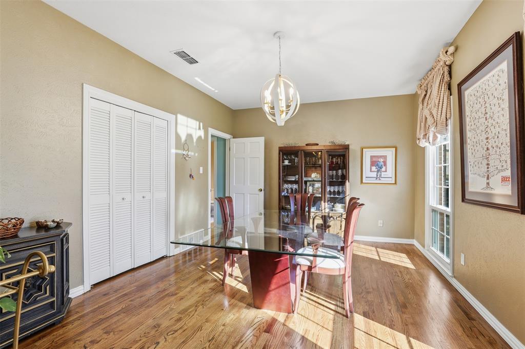 3800 Hollow Creek Road Benbrook, TX 76116 - Photo 16 of 29 a view of a dining room with furniture window and wooden floor