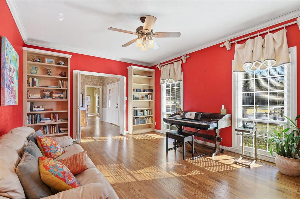 3800 Hollow Creek Road Benbrook, TX 76116 - Photo 17 of 29 a living room filled with furniture and a floor to ceiling window