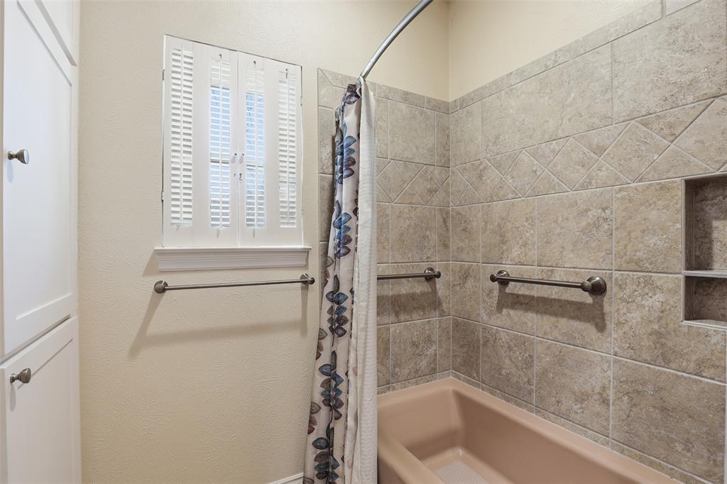 3800 Hollow Creek Road Benbrook, TX 76116 - Photo 20 of 29 a bathroom with a bathtub