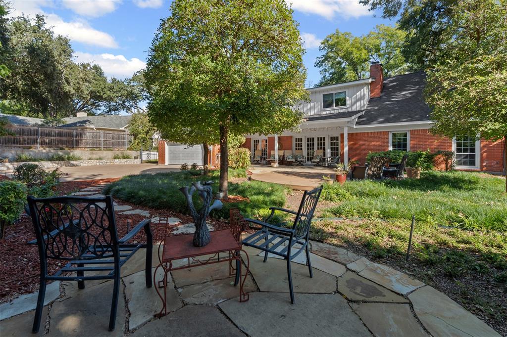 3800 Hollow Creek Road Benbrook, TX 76116 - Photo 27 of 29 a view of house with backyard and seating space